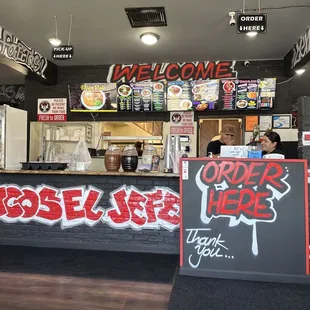 Counter and menu as you walk in.