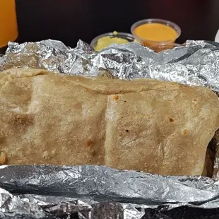 Unflattering pic of supreme burrito before bitting it