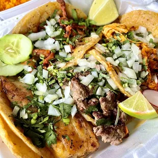 a plate of tacos and rice