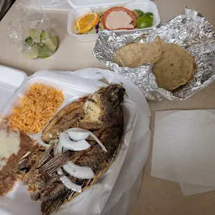 a plate of fish and rice