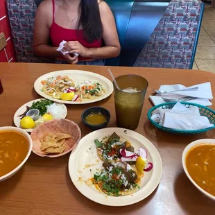 a woman sitting at a table in a mexican restaurant