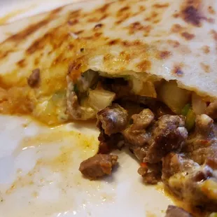 The end portion of the quesadilla was a *little flat