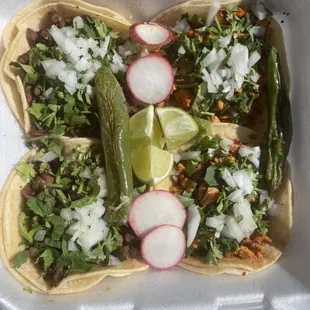 Our street tacos with a combination of carne asada and grilled chicken !!!!