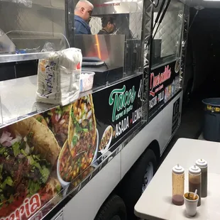 a taco truck parked in a parking lot