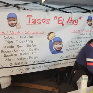 a woman preparing food under a tent