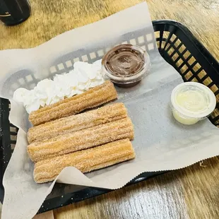 Churros made to order with chocolate dip and sweet cream