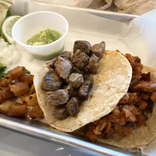 Carne asada and al pastor taco