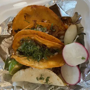 Birria tacos and one barbacoa taco