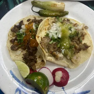 Carnitas and Asada taco with fresh lime, radish and charred onion &amp; jalapeño