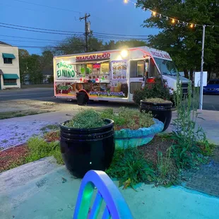 a food truck parked on the side of the road