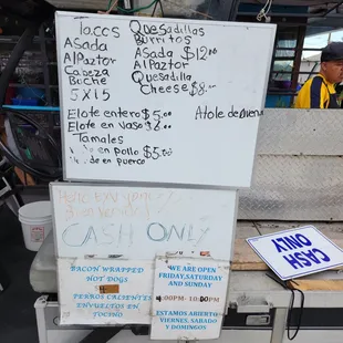 a sign for sale at a food stand