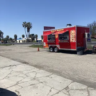 a taco truck parked in a parking lot