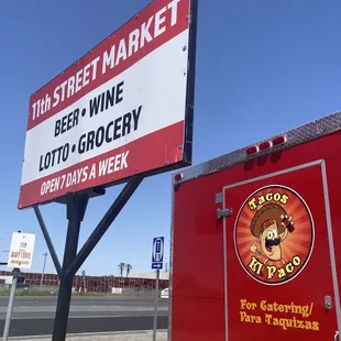 a sign for tim street market