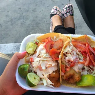 a person holding a plate of food