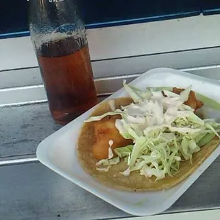 This is a Shrimp taco with cabbage and some delicious cream and this time I requested it with no tomato or chile tacos are good!