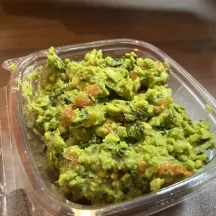 guacamole in a plastic container