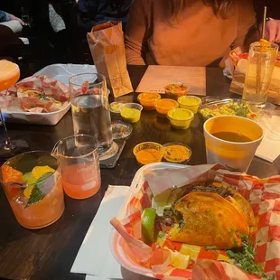 a table full of food and drinks