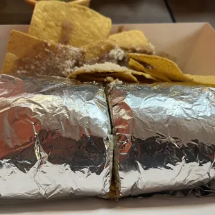 a burrito wrapped in aluminum foil