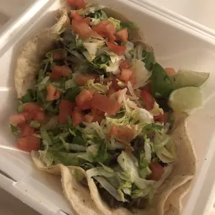 Steak tacos with lettuce, tomatoes, cheese (extra $ for toppings)