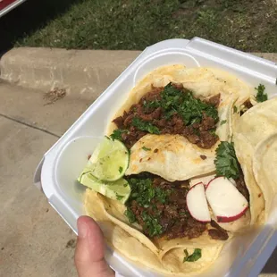 two people ordering food from a food truck