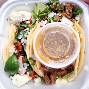 Al pastor &amp; asada tacos..Carne asada better of two, but I loved the addition of queso fresco.