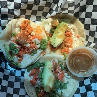 three tacoss in a basket