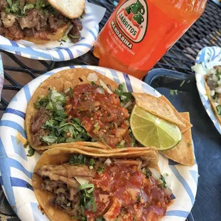 Carnitas tacos with famous mexican soda Jarritos on the side