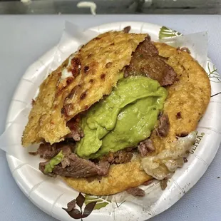 Our newest item, the gordita, loaded with your choice of meat and topped with lettuce, crema, and salsa.