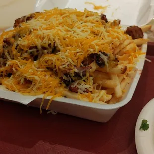 Pastor fries (normally includes sour cream and guacamole)