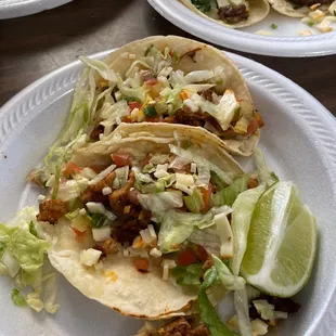 three plates of tacos and rice