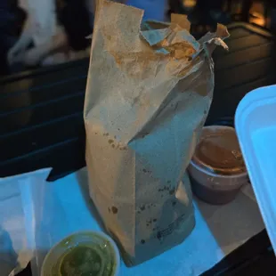 Chips and salsa.  Not enough salsa (the container on the right).
