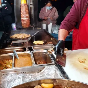 Chef crisoin up chicken for Chicken Tacos