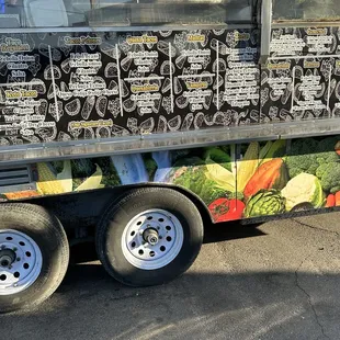 a food truck with a lot of menus