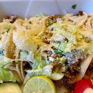Lettuce, pinto beans, and cheese come standard on tacos.