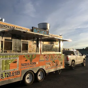a taco truck parked in a parking lot