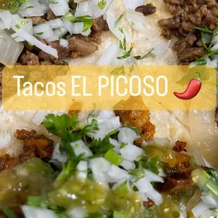 a plate of tacos and a cucumber