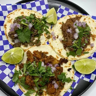 three tacoss on a plate