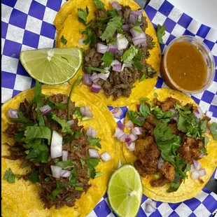 three tacoss on a plate