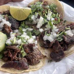 asada tacos, nicely, marinated, with a just right char onions, and cilantro.