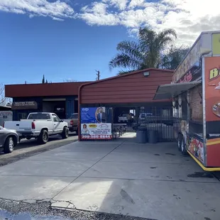 a taco truck parked in front of a restaurant