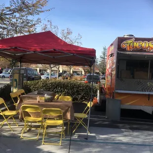a food truck and tables