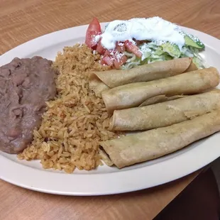 Taquitos de papa. Salad on the side instead of on top, keeps the taquitos warm and crunchy.
