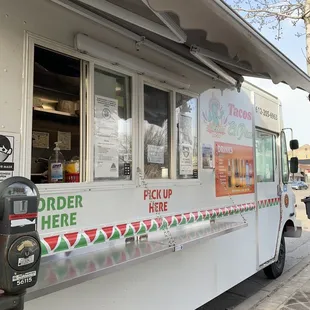 a food truck parked on the side of the road
