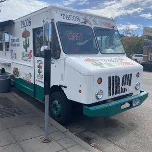 a food truck parked on the side of the road