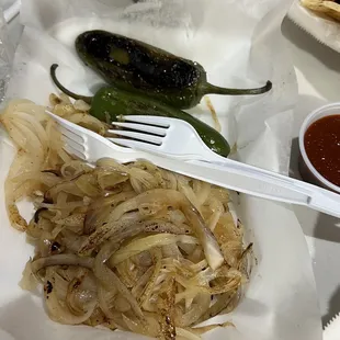 a plate of onions and chilis