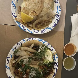 Al pastor quesadilla and Al pastor tacos with green salsa and orange sauce
