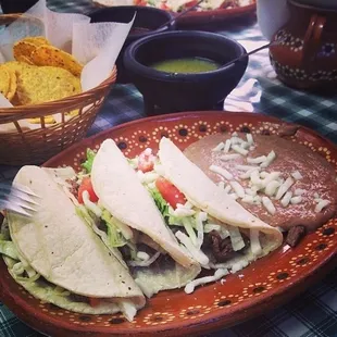 Tacos barbocoa--they can do them with authentic cilantro and onion or lettuce/cheese; both are great. With a soda for under $7.