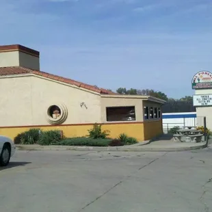 a car parked in front of a restaurant