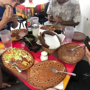 a group of people sitting around a table