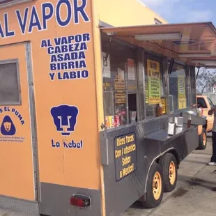Taco truck in back of gas station